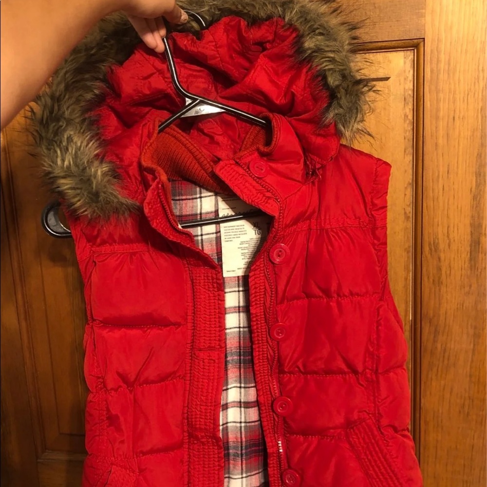 Red Aeropostale puffer vest in great condition with plaid and faux fur hood